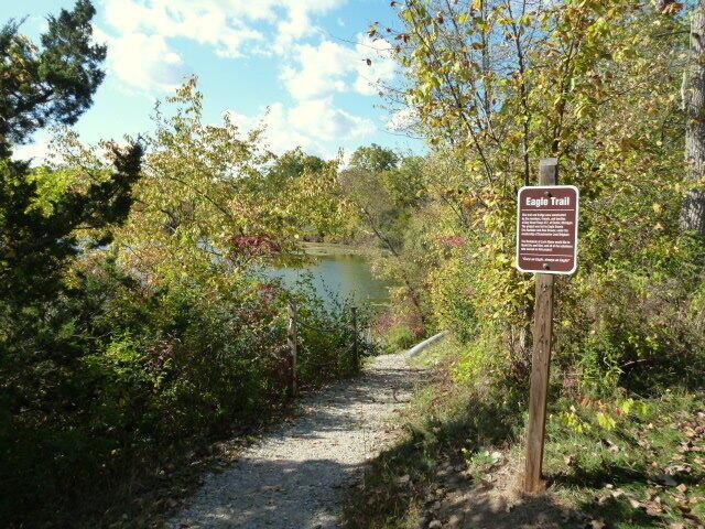 surrounding community featuring a wooded view and a water view