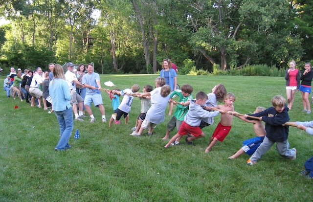 view of property's community with a lawn
