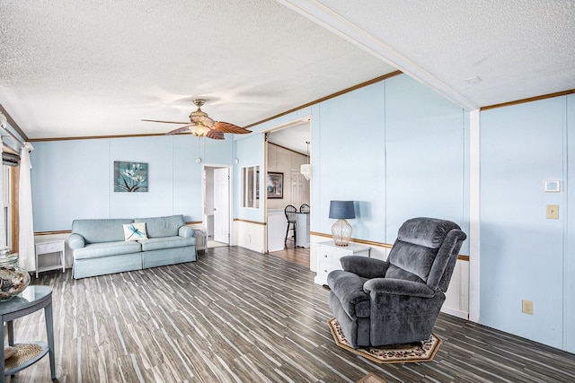 347 Lou Alice Dr, Columbiaville, MI 48421 - living area featuring crown molding, a textured ceiling, a ceiling fan, and wood finished floors
