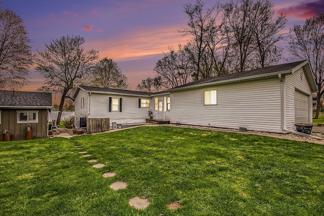 347 Lou Alice Dr, Columbiaville, MI 48421 - back of property with an outdoor structure, a yard, and a garage