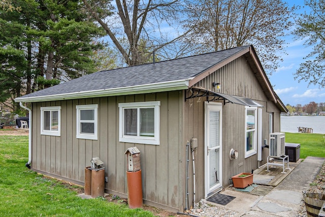 347 Lou Alice Dr, Columbiaville, MI 48421 - view of outbuilding featuring an outdoor structure, a water view, and ac unit