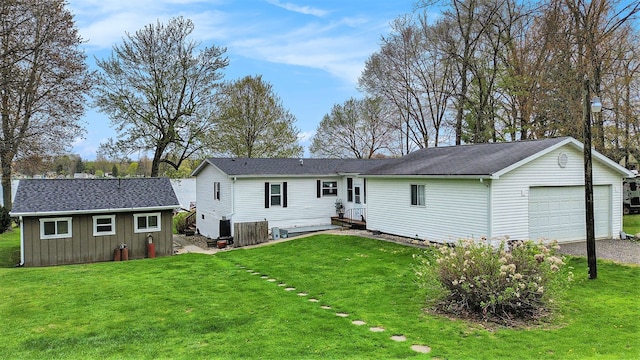 347 Lou Alice Dr, Columbiaville, MI 48421 - back of house with an outdoor structure and a yard