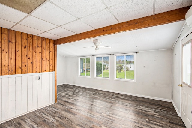 347 Lou Alice Dr, Columbiaville, MI 48421 - spare room featuring wood walls, beam ceiling, ceiling fan, wood finished floors, and baseboards