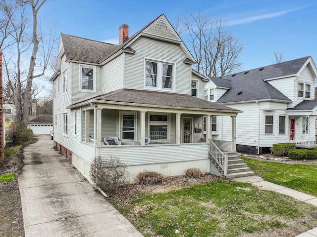 475 Saint Clair St, Grosse Pointe, MI 48230 - victorian-style house with an outbuilding, covered porch, roof with shingles, a chimney, and a detached garage