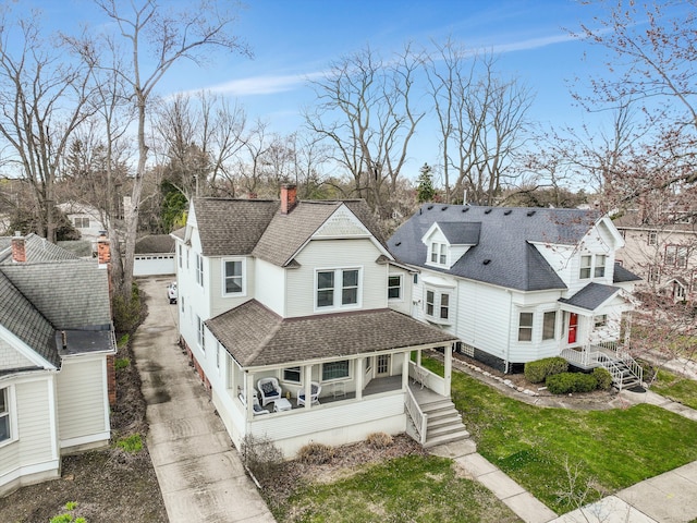 475 Saint Clair St, Grosse Pointe, MI 48230 - back of property with covered porch, a residential view, roof with shingles, and a chimney