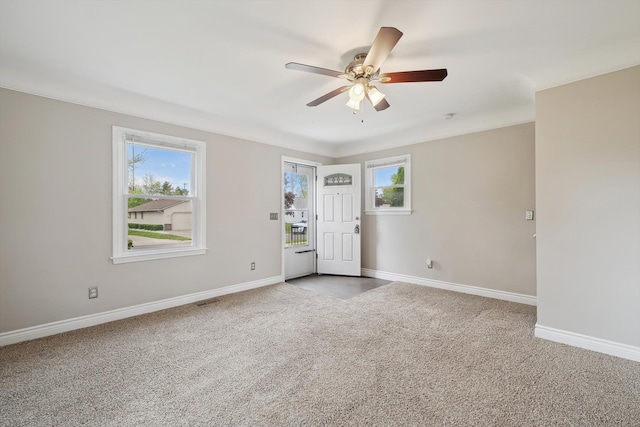 3040 Waukegan St, Auburn Hills, MI 48326 - carpeted empty room with healthy amount of natural light, a ceiling fan, and baseboards