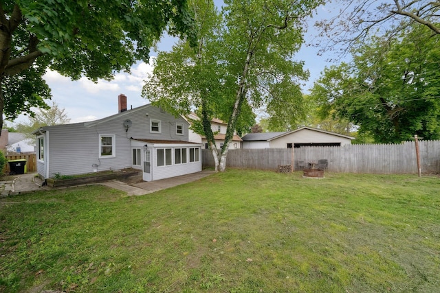 3040 Waukegan St, Auburn Hills, MI 48326 - rear view of property with a chimney and a patio