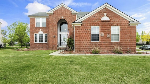 56501 Winding Creek Dr, Macomb, MI 48042 - view of front of home featuring brick siding and a front lawn