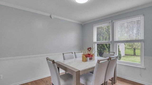 56501 Winding Creek Dr, Macomb, MI 48042 - dining area with wood finished floors, plenty of natural light, crown molding, and baseboards