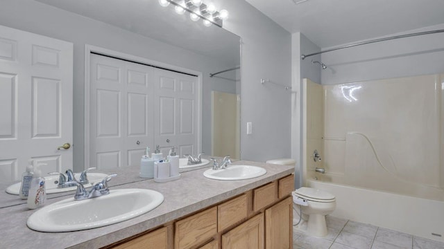 56501 Winding Creek Dr, Macomb, MI 48042 - bathroom with bathtub / shower combination, toilet, tile patterned flooring, and double vanity