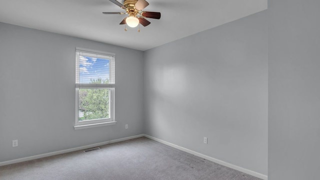56501 Winding Creek Dr, Macomb, MI 48042 - carpeted empty room featuring plenty of natural light, baseboards, and a ceiling fan