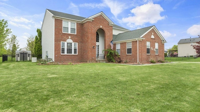 56501 Winding Creek Dr, Macomb, MI 48042 - view of front of home with brick siding, a storage shed, and an outdoor structure