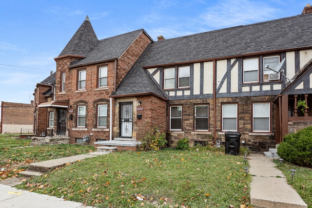 1946 Ewald Cir, Detroit, MI 48238 - view of front of property featuring a front yard and a chimney