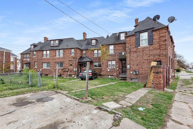 1946 Ewald Cir, Detroit, MI 48238 - back of property with a chimney and brick siding