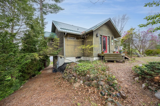 view of front of home with metal roof and a standing seam roof