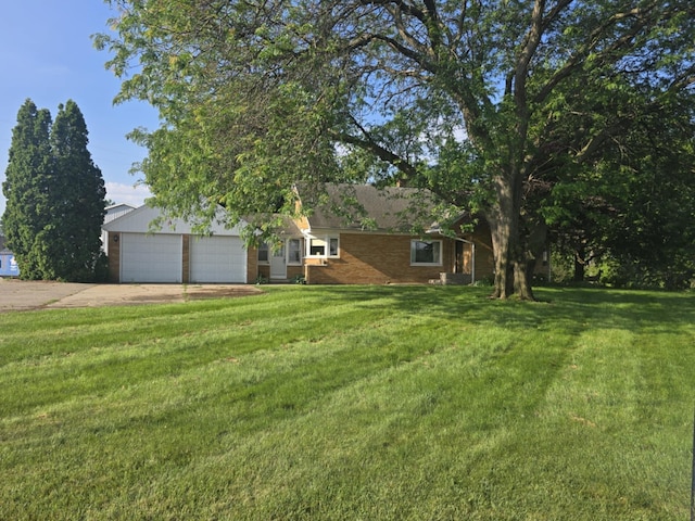 4618 New Holland St, Hudsonville, MI 49426 - view of front of property featuring driveway, a front yard, brick siding, and a garage