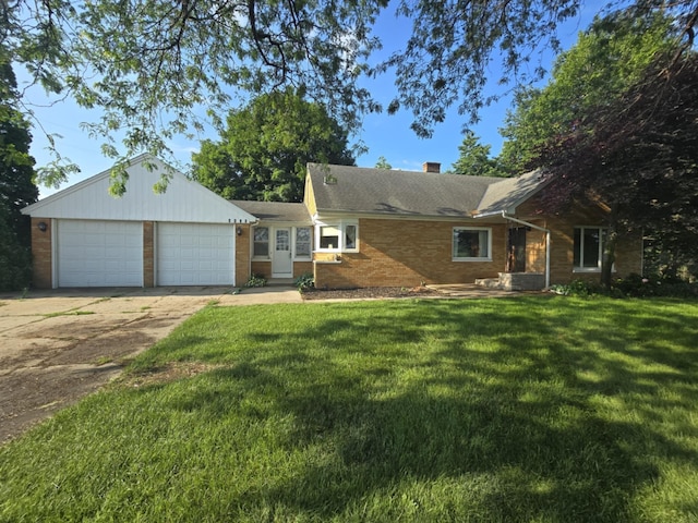 4618 New Holland St, Hudsonville, MI 49426 - single story home featuring driveway, brick siding, a front yard, a garage, and a chimney