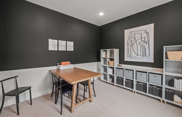 office with carpet floors and recessed lighting