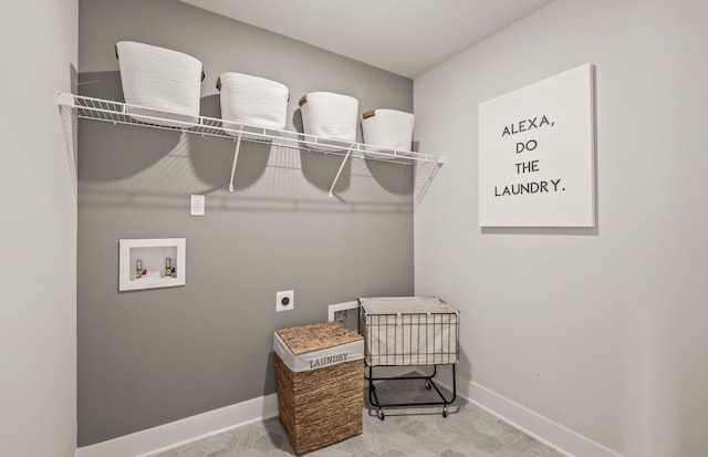 washroom with hookup for an electric dryer, hookup for a washing machine, and baseboards
