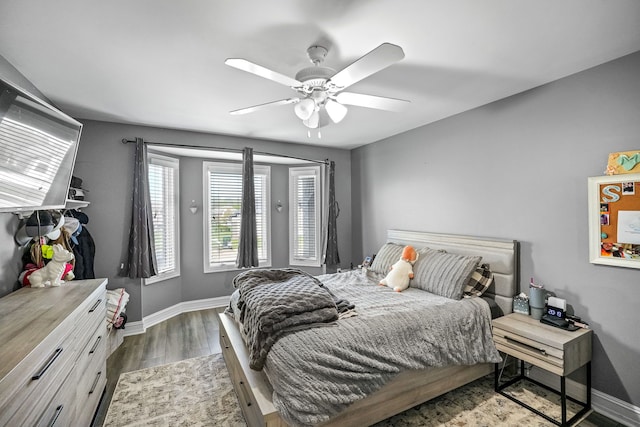 62702 Somerset Blvd, Washington, MI 48094 - bedroom featuring wood finished floors, baseboards, and ceiling fan