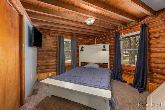 5359 Huck Dr, Sheridan, MI 48884 - bedroom featuring carpet, beamed ceiling, wood ceiling, and log walls