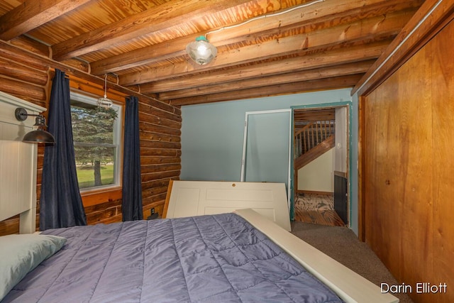 5359 Huck Dr, Sheridan, MI 48884 - bedroom with rustic walls, wooden ceiling, and beam ceiling