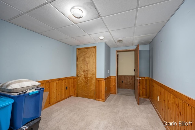 5359 Huck Dr, Sheridan, MI 48884 - bonus room with a wainscoted wall, wooden walls, and light colored carpet
