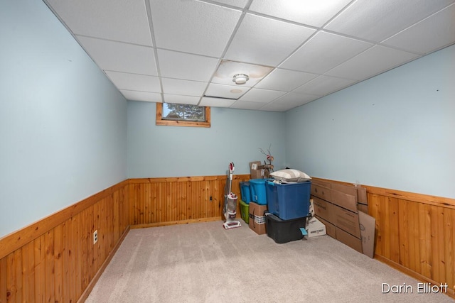 5359 Huck Dr, Sheridan, MI 48884 - finished basement featuring wooden walls, wainscoting, carpet flooring, and a drop ceiling