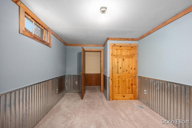 5359 Huck Dr, Sheridan, MI 48884 - carpeted spare room featuring wainscoting and crown molding