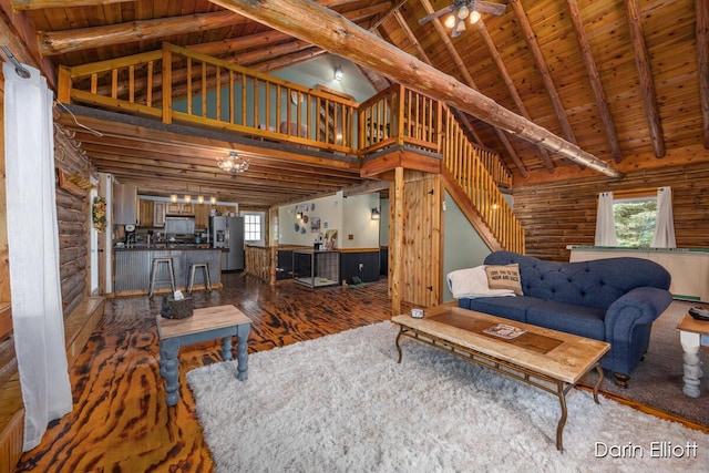 5359 Huck Dr, Sheridan, MI 48884 - living area with wood ceiling, high vaulted ceiling, beamed ceiling, ceiling fan, and wood finished floors