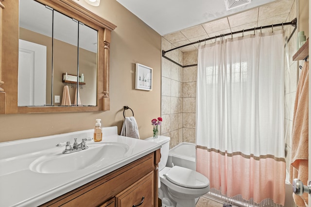 full bathroom with toilet, shower / tub combo with curtain, and vanity