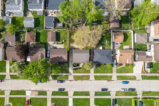 aerial view of property and surrounding area featuring nearby suburban area