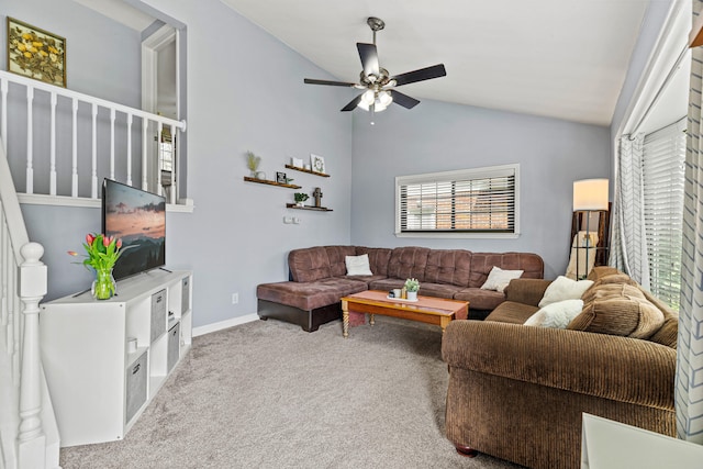 carpeted living room with vaulted ceiling, a ceiling fan, and baseboards