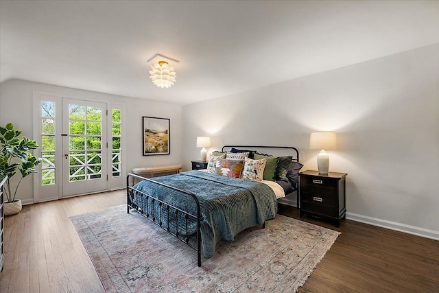 75 Grosse Pointe Blvd, Grosse Pointe Farms, MI 48236 - bedroom featuring access to exterior, wood finished floors, baseboards, and vaulted ceiling