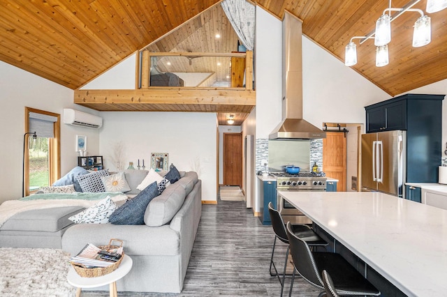 kitchen featuring stainless steel appliances, open floor plan, high vaulted ceiling, wood ceiling, and a wall mounted air conditioner