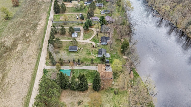 aerial view of property's location with a large body of water