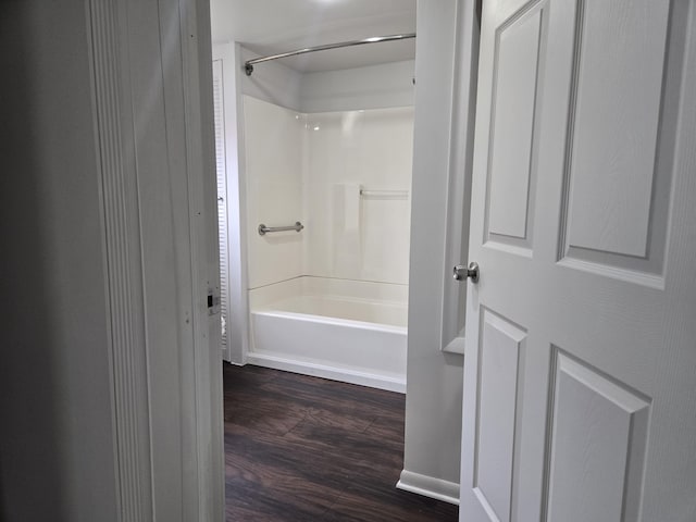 full bath featuring wood finished floors and shower / bath combination