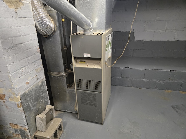 utility room with heating unit
