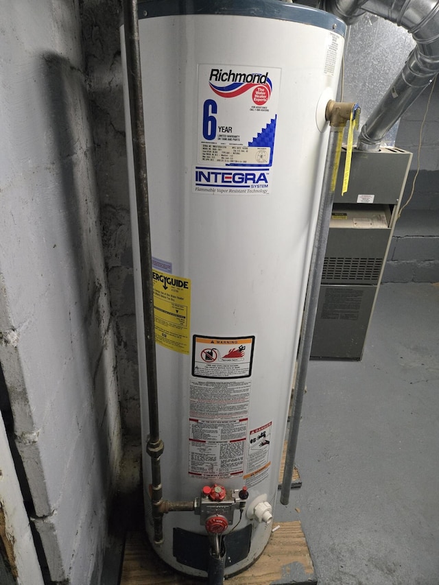 utility room featuring gas water heater