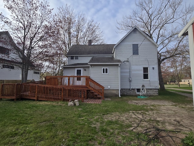 back of house with a shingled roof, a yard, a deck, and a chimney