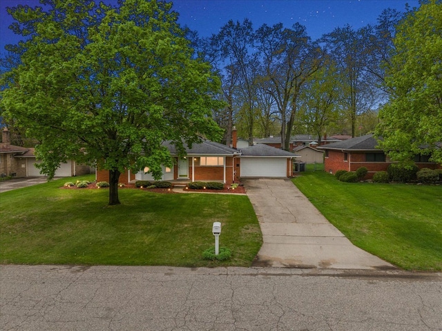 view of front facade featuring concrete driveway, a front yard, and a porch