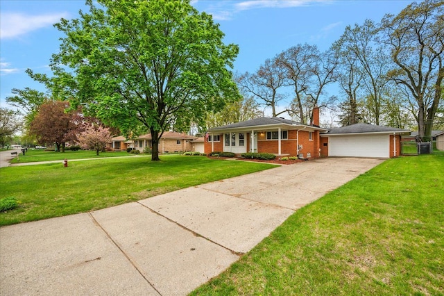 view of front of home with brick siding, driveway, a chimney, and an attached garage