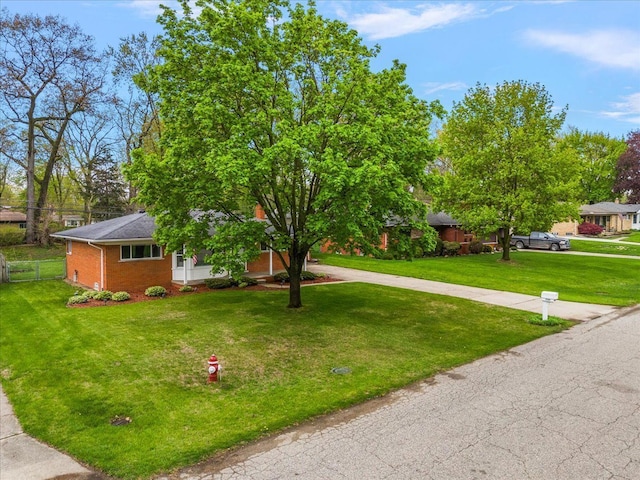 obstructed view of property featuring brick siding