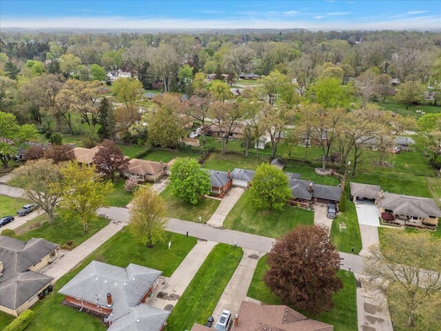 aerial view of property and surrounding area with nearby suburban area