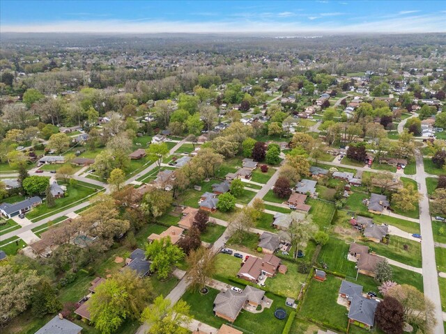 aerial view of property and surrounding area with nearby suburban area