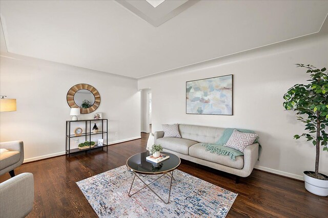 living area featuring wood finished floors and baseboards