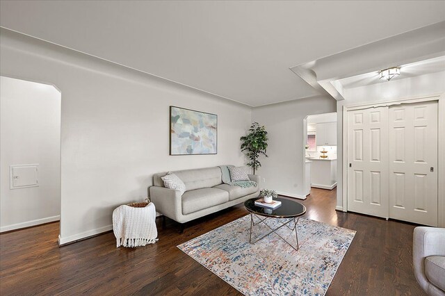 living room featuring wood finished floors and baseboards