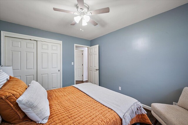 bedroom with a closet, baseboards, and ceiling fan