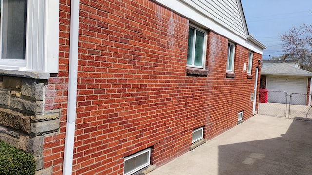 23162 Saxony Ave, Eastpointe, MI 48021 - view of property exterior featuring brick siding, an outbuilding, and a detached garage