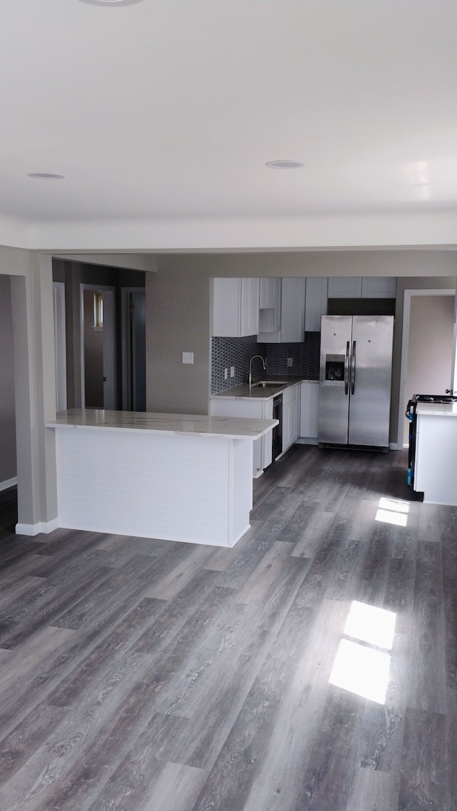 23162 Saxony Ave, Eastpointe, MI 48021 - kitchen with stainless steel fridge, dark wood finished floors, modern cabinets, light countertops, and a sink